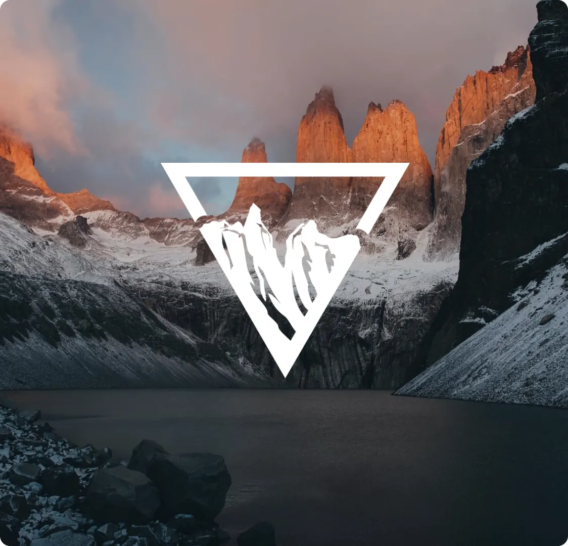 The triangular Venture logo mark in white over a photograph of rock spires at dusk.